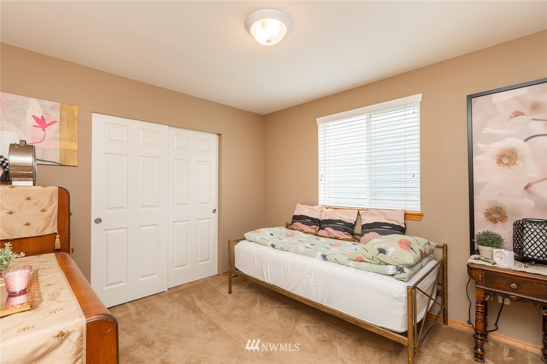659 Shadow Avenue Northeast Renton, WA 98059 - Photo 22 of 37 a bedroom with a bed and a window