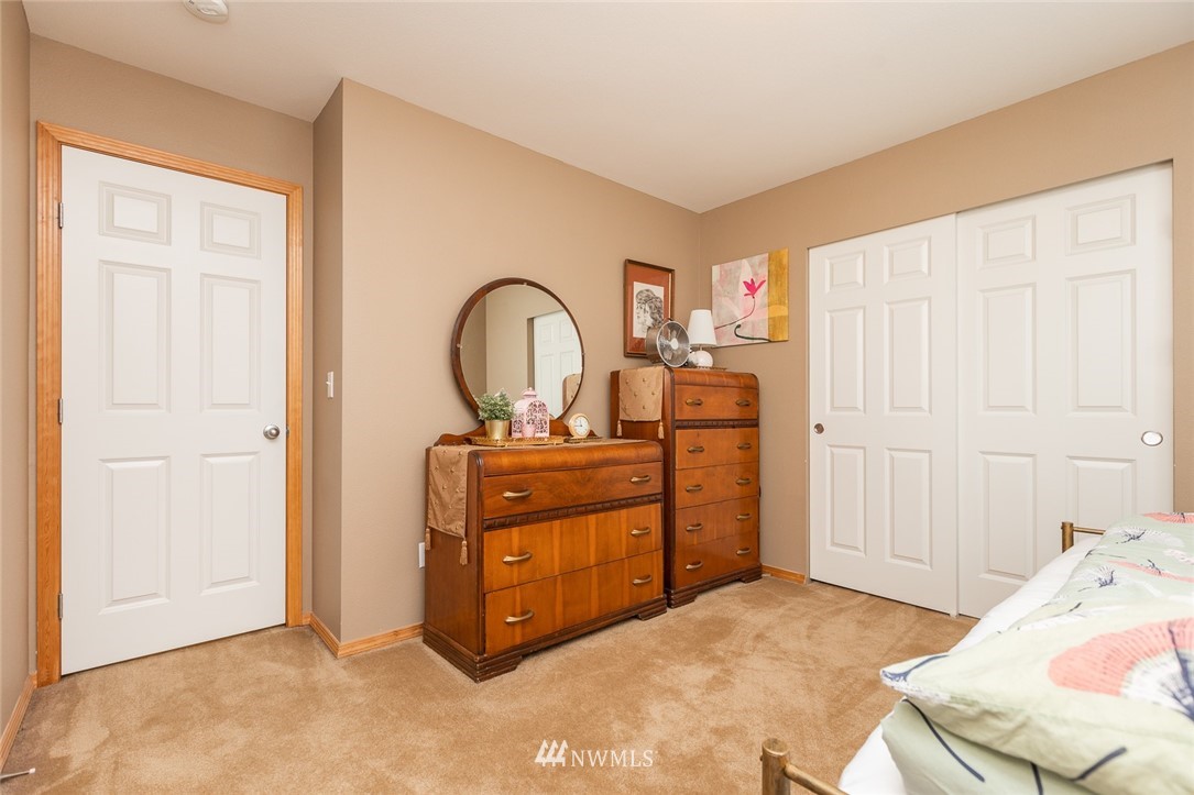 659 Shadow Avenue Northeast Renton, WA 98059 - Photo 23 of 37 a bed room with a bed and a dresser