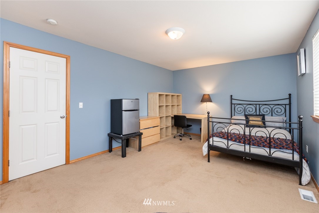 659 Shadow Avenue Northeast Renton, WA 98059 - Photo 27 of 37 a bedroom with furniture and a window