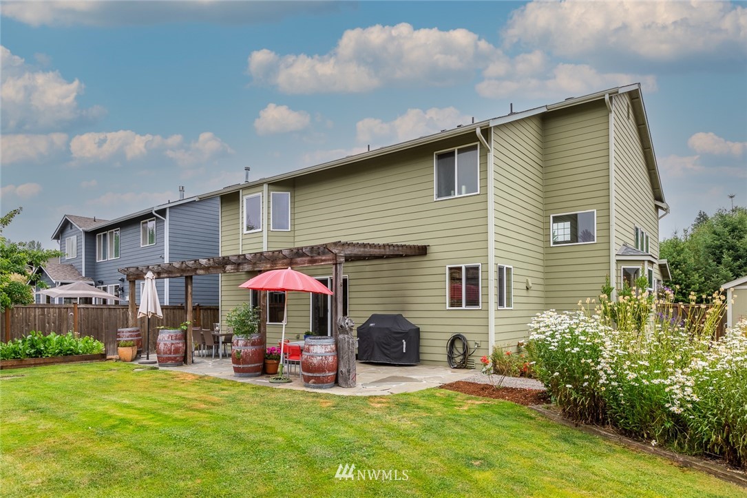 659 Shadow Avenue Northeast Renton, WA 98059 - Photo 28 of 37 a view of a house with backyard and porch