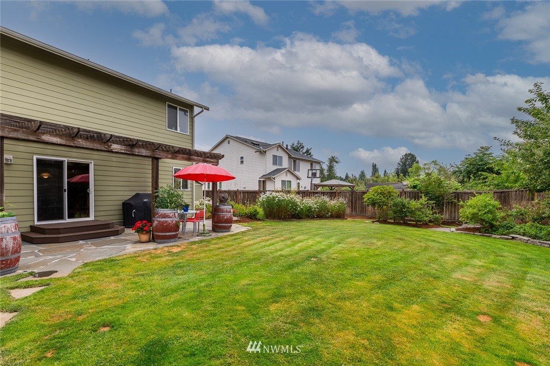 659 Shadow Avenue Northeast Renton, WA 98059 - Photo 29 of 37 a view of a house with backyard porch and sitting area