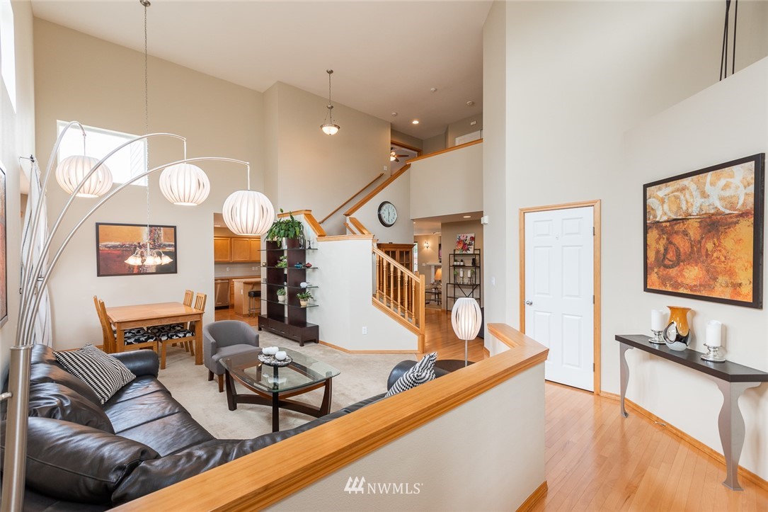 659 Shadow Avenue Northeast Renton, WA 98059 - Photo 4 of 37 a living room with furniture and wooden floor