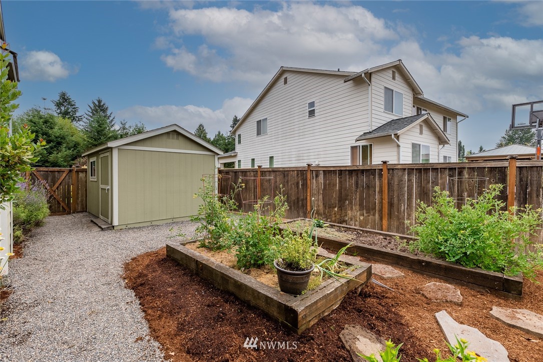 659 Shadow Avenue Northeast Renton, WA 98059 - Photo 32 of 37 a view of a house with wooden fence in front