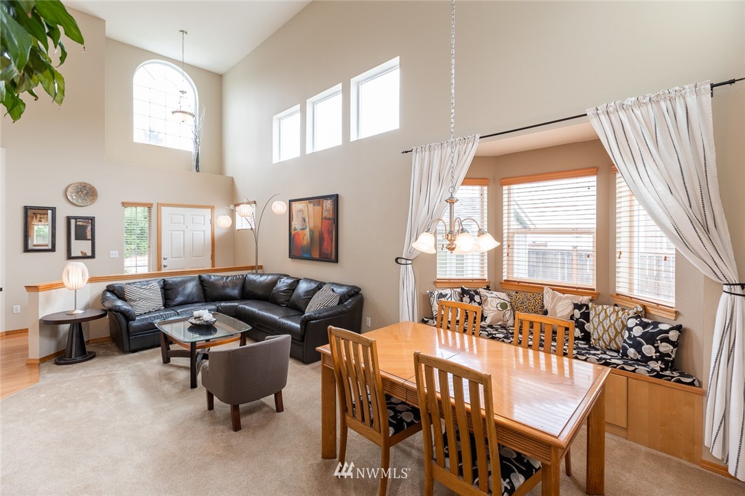 659 Shadow Avenue Northeast Renton, WA 98059 - Photo 6 of 37 a living room with furniture and a large window