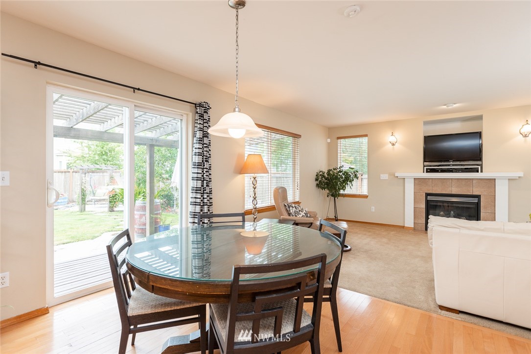 659 Shadow Avenue Northeast Renton, WA 98059 - Photo 9 of 37 a view of a dining room with furniture window and outside view