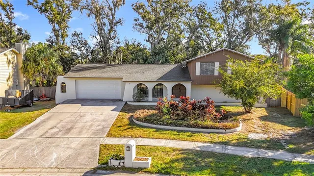 a aerial view of a house with swimming pool and sitting area