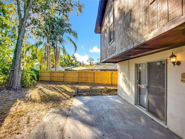 a view of a backyard of the house
