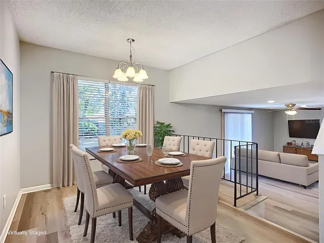 a view of a dining room with furniture window and outside view