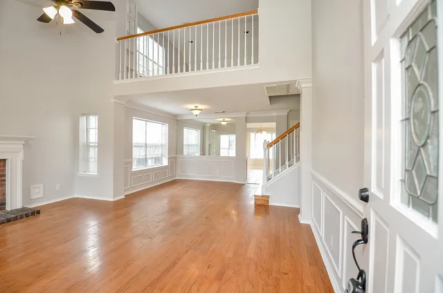 a view of an entryway with wooden floor