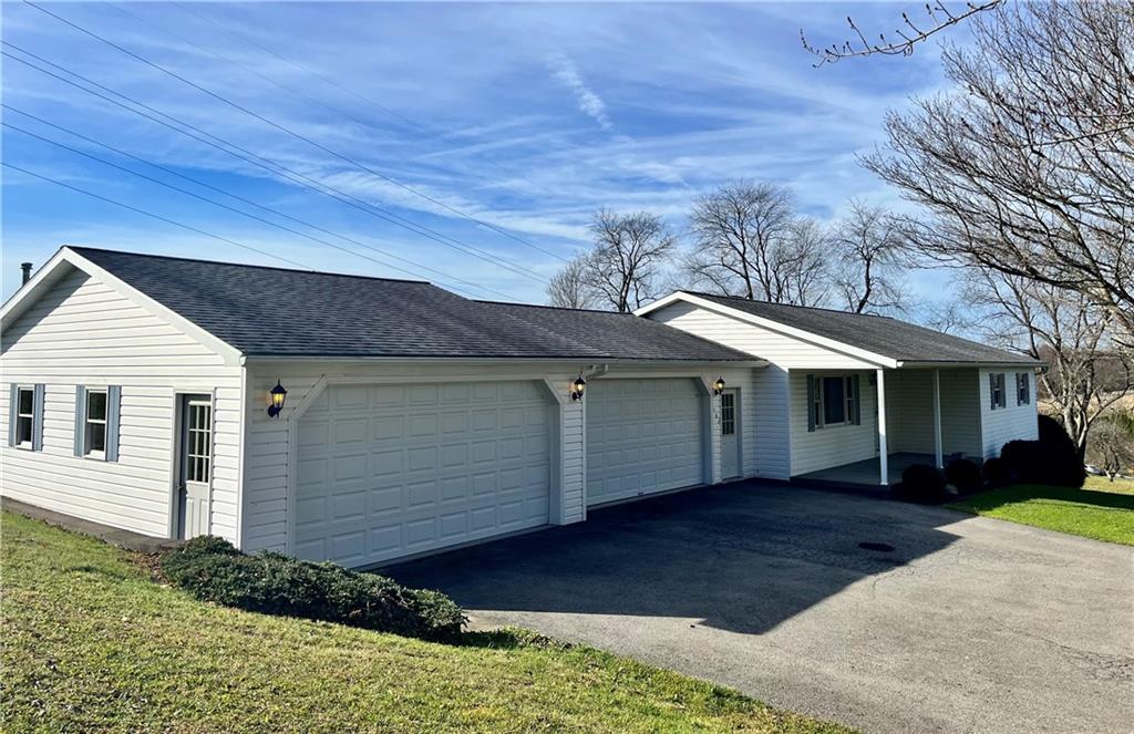 180 Dreher Road Butler, PA 16002 - Photo 5 of 25 a front view of a house with a yard and garage