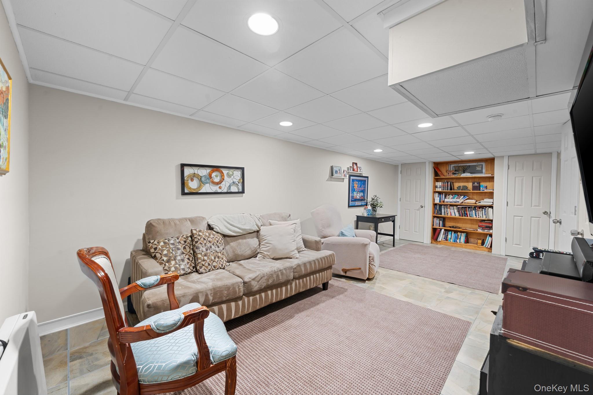 3530 Long Beach Road, Unit 44 Oceanside, NY 11572 - Photo 12 of 17 a living room with furniture and a couch