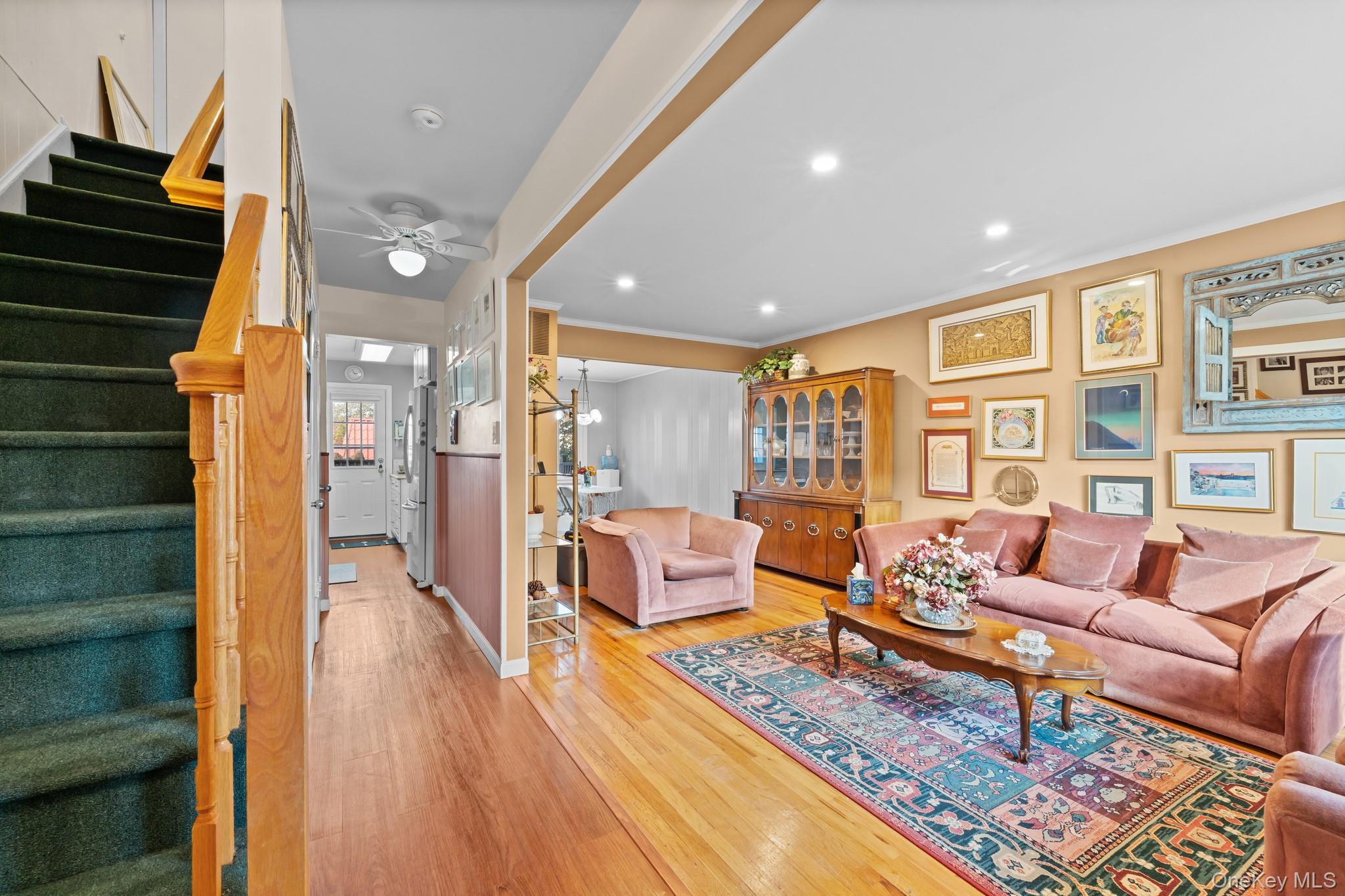 3530 Long Beach Road, Unit 44 Oceanside, NY 11572 - Photo 2 of 17 a living room with furniture and wooden floor