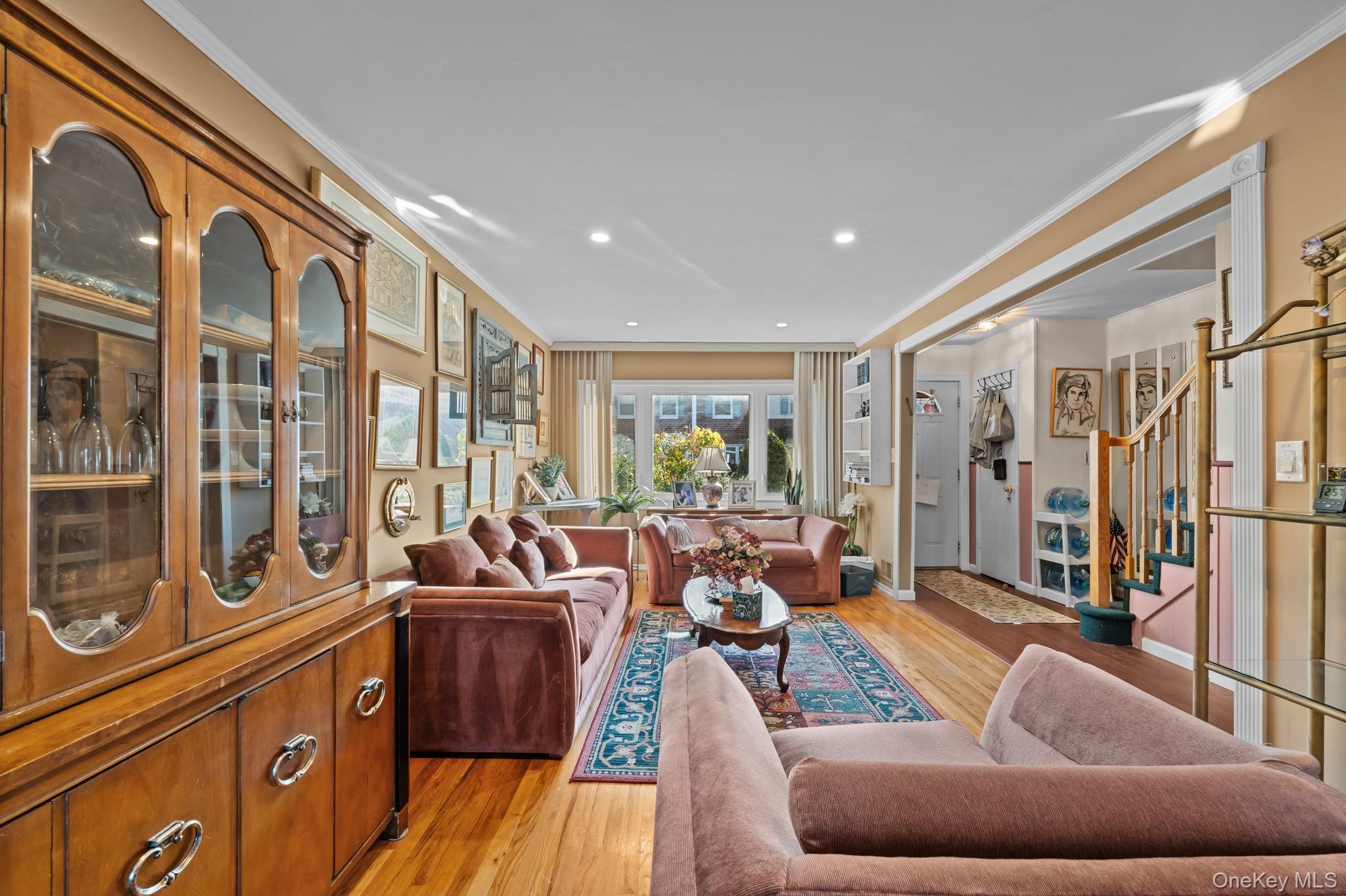 3530 Long Beach Road, Unit 44 Oceanside, NY 11572 - Photo 4 of 17 a living room with furniture and a large window
