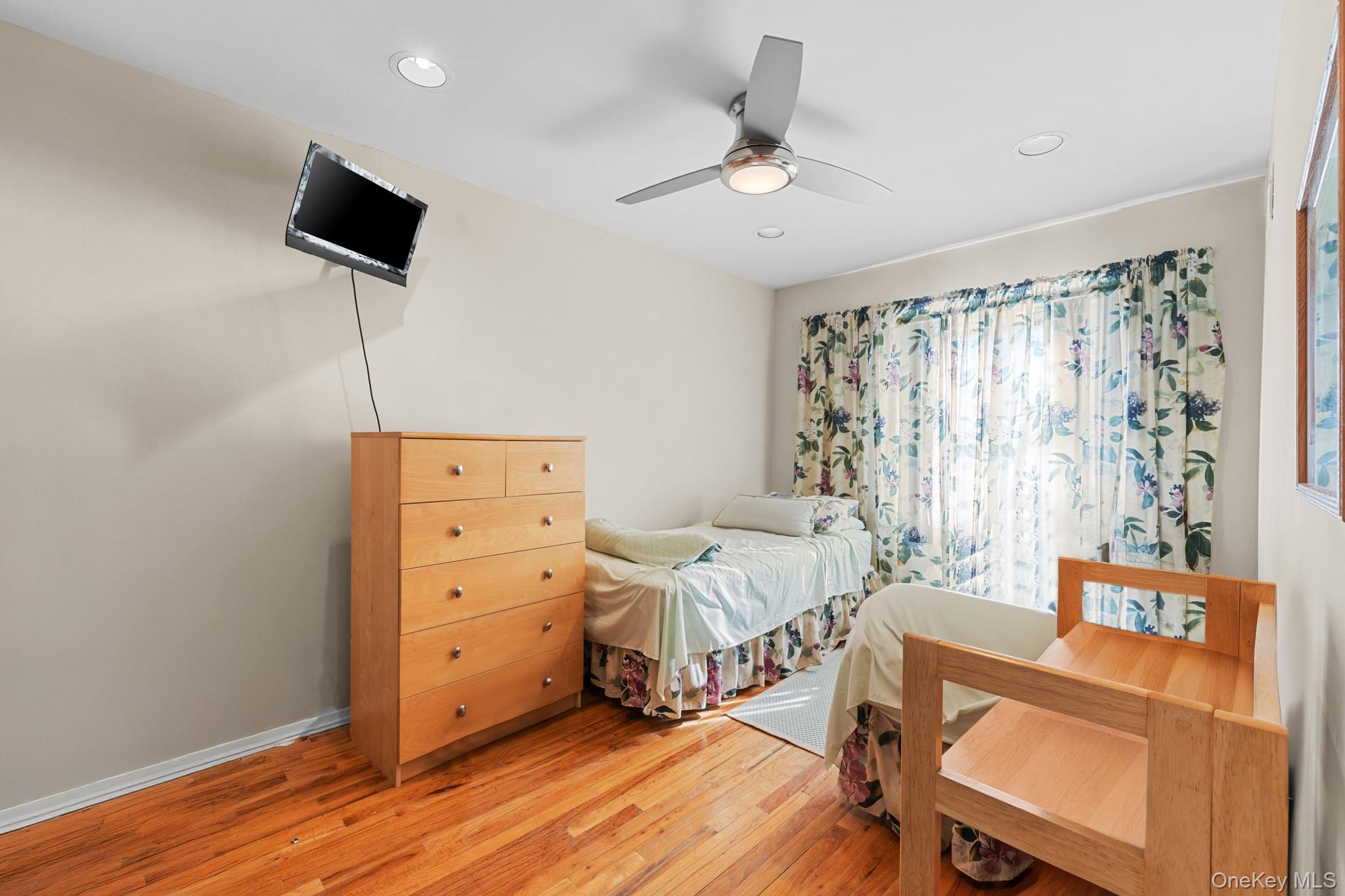 3530 Long Beach Road, Unit 44 Oceanside, NY 11572 - Photo 9 of 17 a view of a livingroom with furniture and a flat screen tv