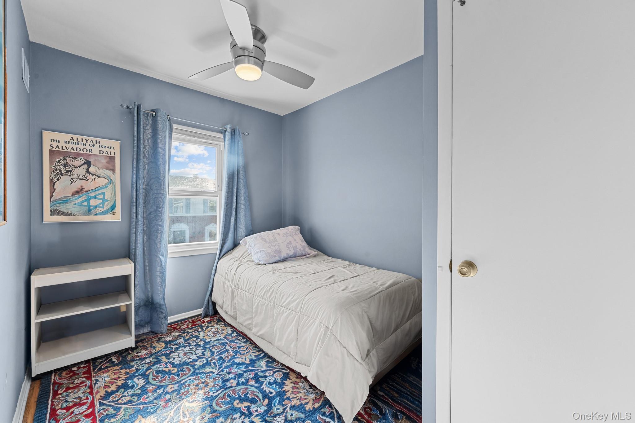 3530 Long Beach Road, Unit 44 Oceanside, NY 11572 - Photo 10 of 17 a bedroom with a bed and a walk in closet