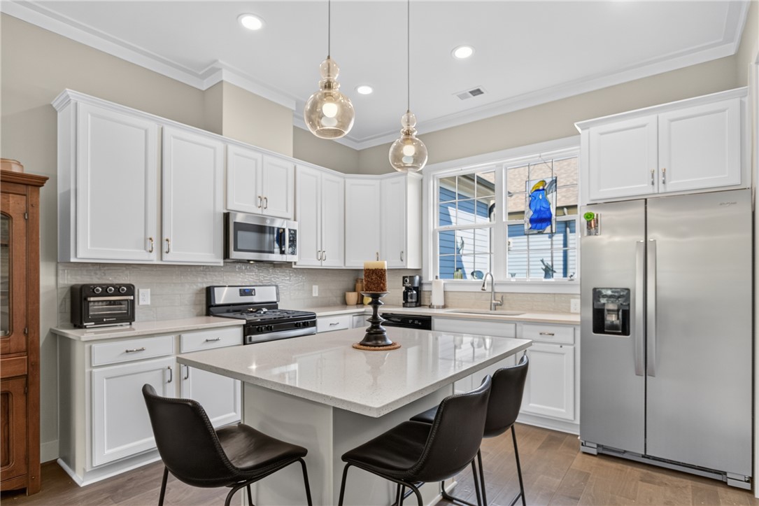 112 Tuttle Street Clemson, SC 29631 - Photo 16 of 46 Culinary delights await in this bright kitchen with a spacious island, ideal for entertaining.