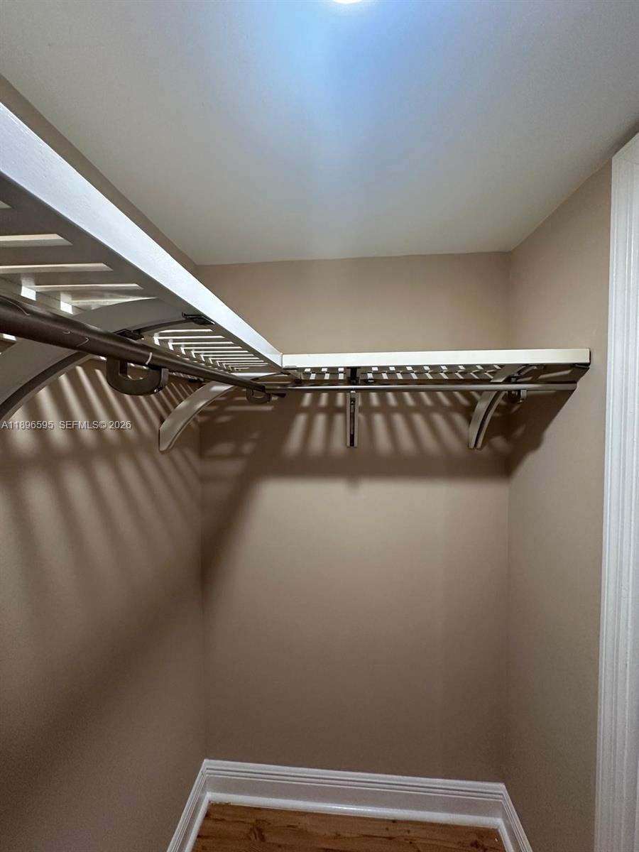 9848 Marina Boulevard, Unit 811 Boca Raton, FL 33428 - Photo 57 of 86 Master bedroom walk in closet