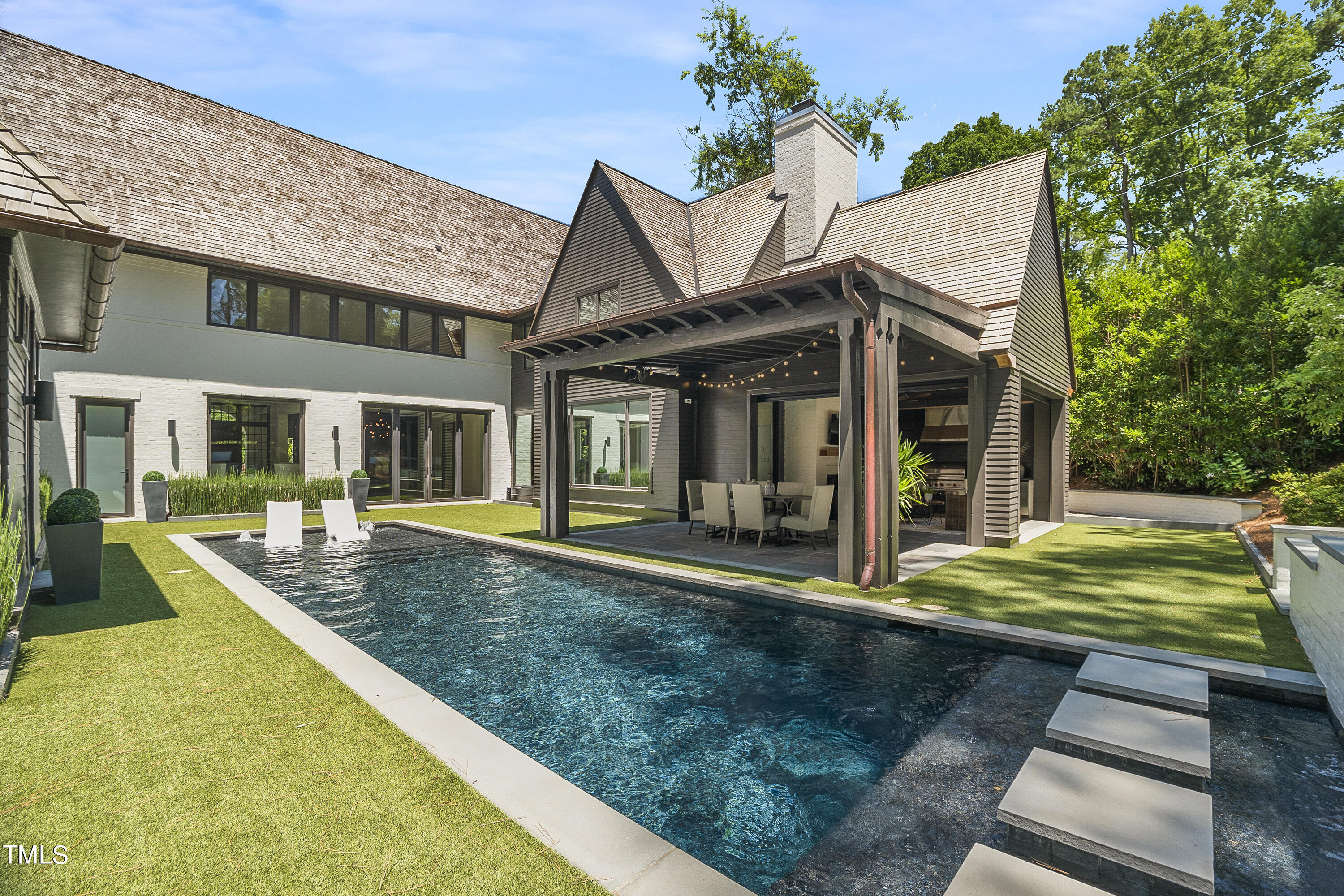 1722 Banbury Road Raleigh, NC 27608 - Photo 2 of 4 a view of a house with backyard and sitting area