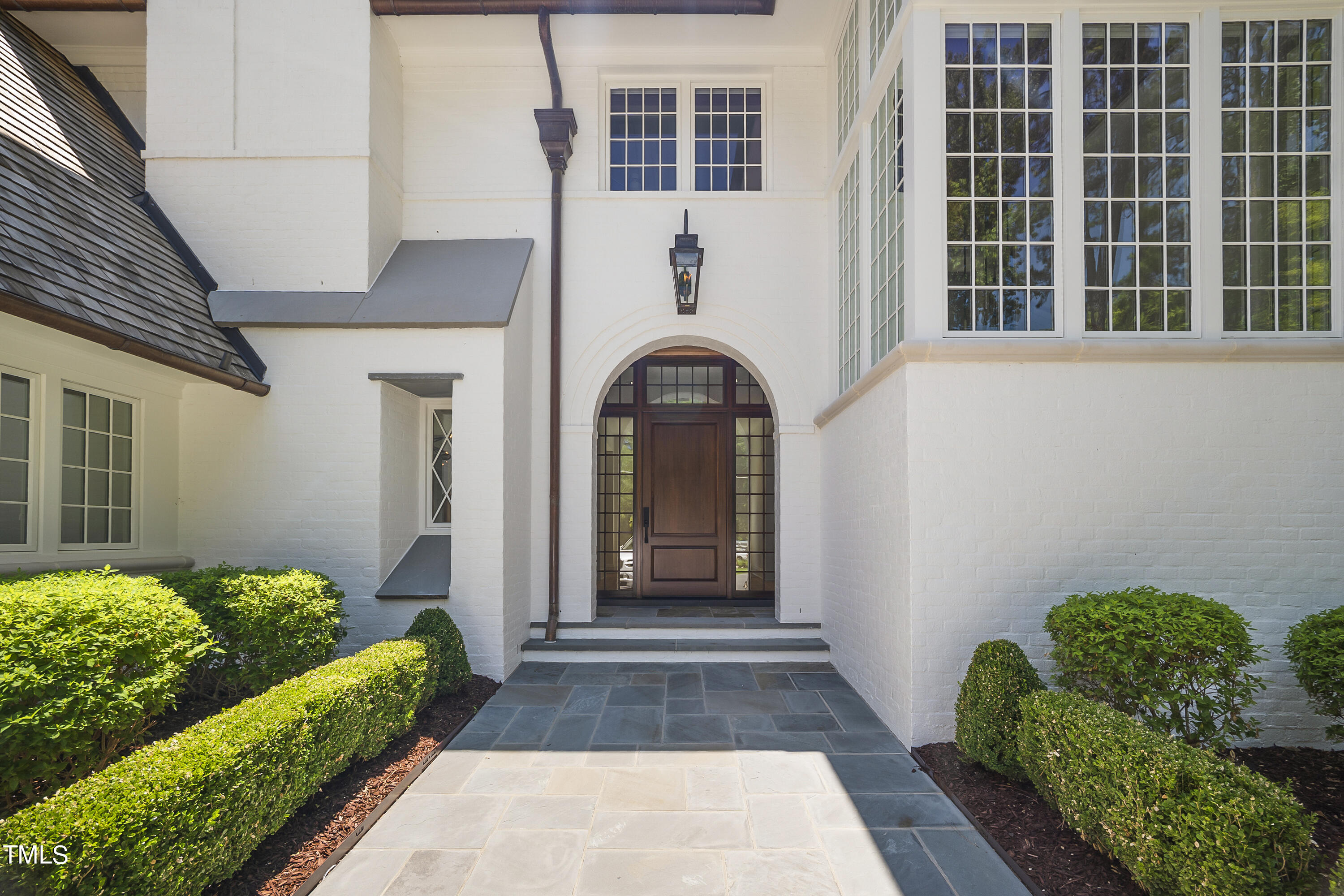 1722 Banbury Road Raleigh, NC 27608 - Photo 3 of 4 a front view of a house with a garden