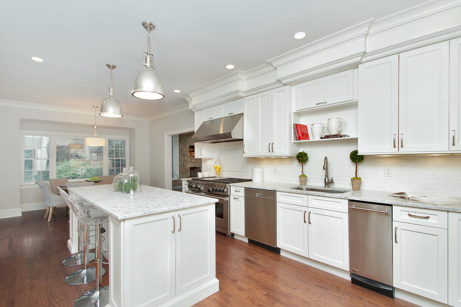 222 Marshall Ridge Road New Canaan, CT 06840 - Photo 11 of 49 a kitchen that has a lot of white cabinets and stainless steel appliances