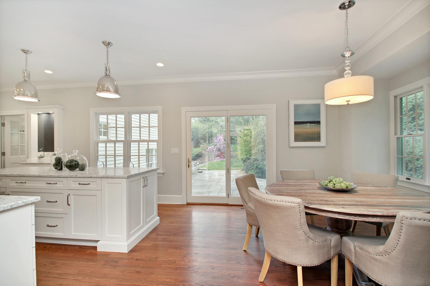 222 Marshall Ridge Road New Canaan, CT 06840 - Photo 16 of 49 a dining room with furniture a chandelier and wooden floor