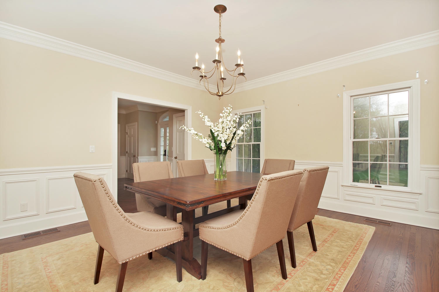 222 Marshall Ridge Road New Canaan, CT 06840 - Photo 25 of 49 a dining room with furniture wooden floor and a chandelier