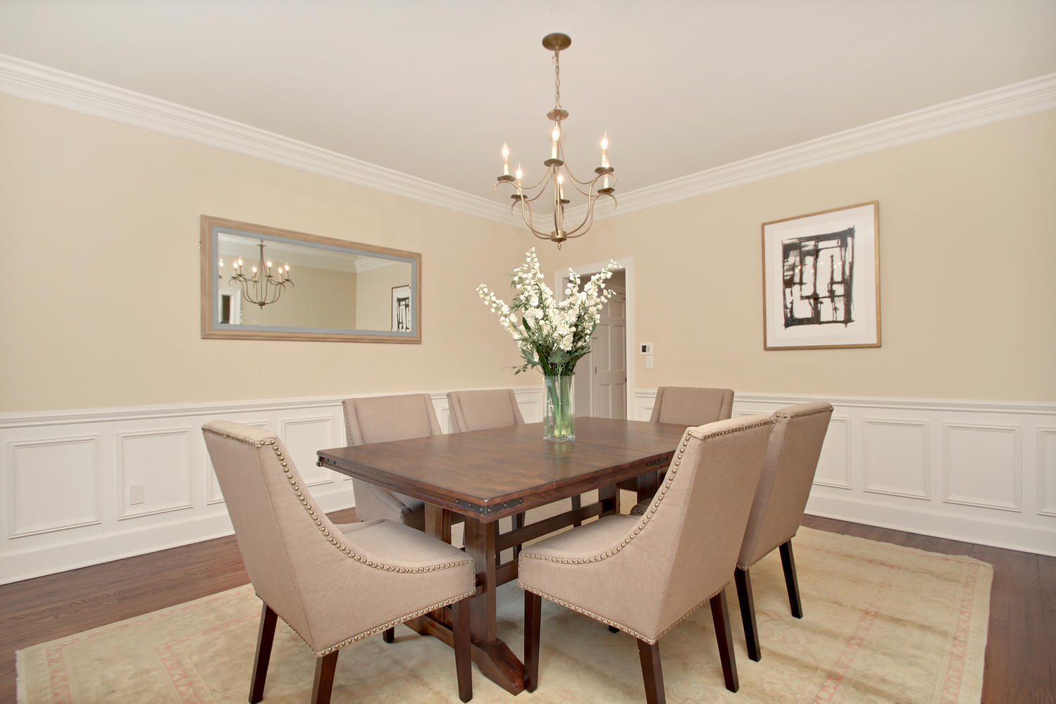 222 Marshall Ridge Road New Canaan, CT 06840 - Photo 26 of 49 a view of a dining room with furniture and chandelier