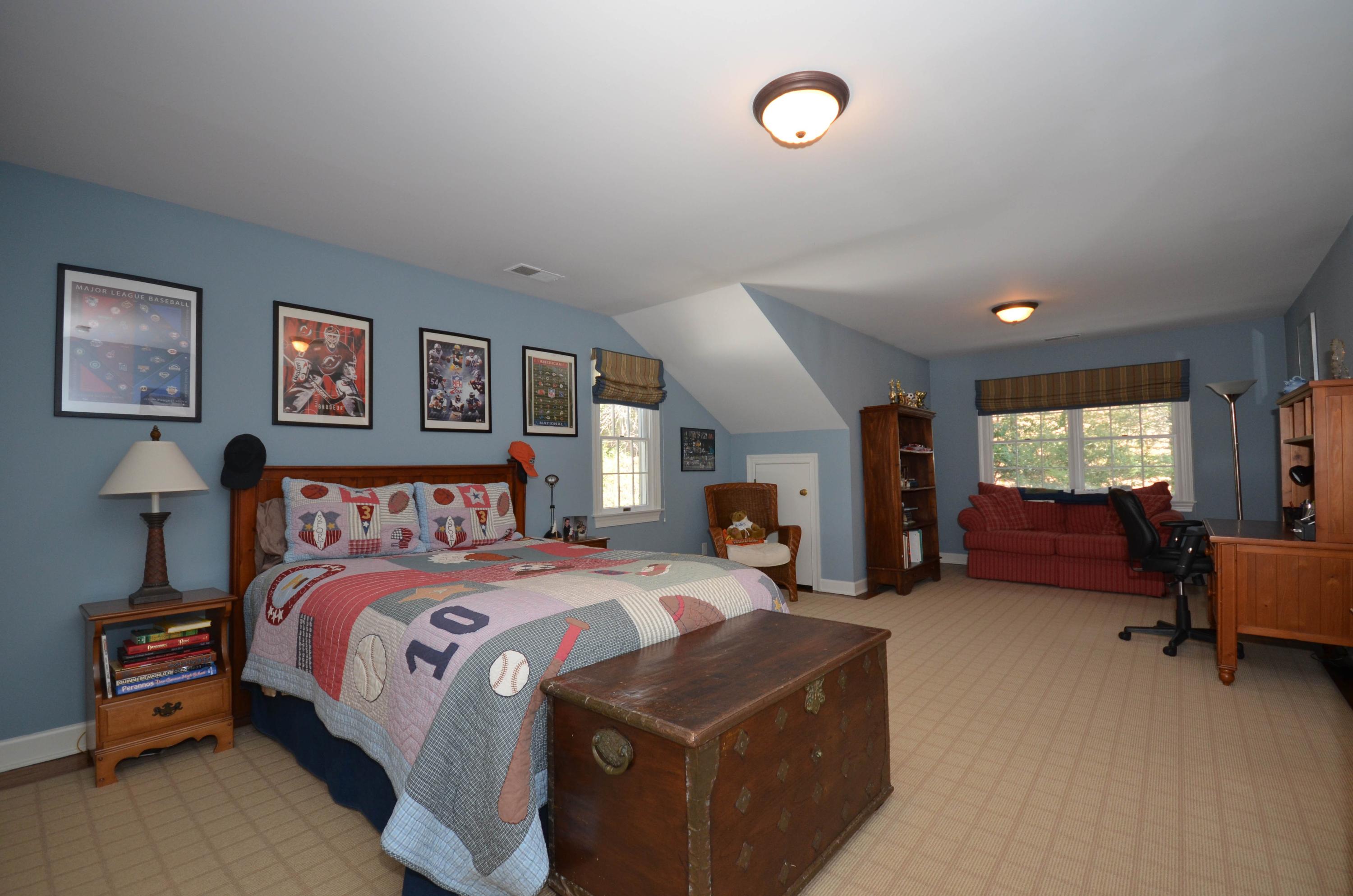 222 Marshall Ridge Road New Canaan, CT 06840 - Photo 32 of 49 a bed room with a bed and a tv