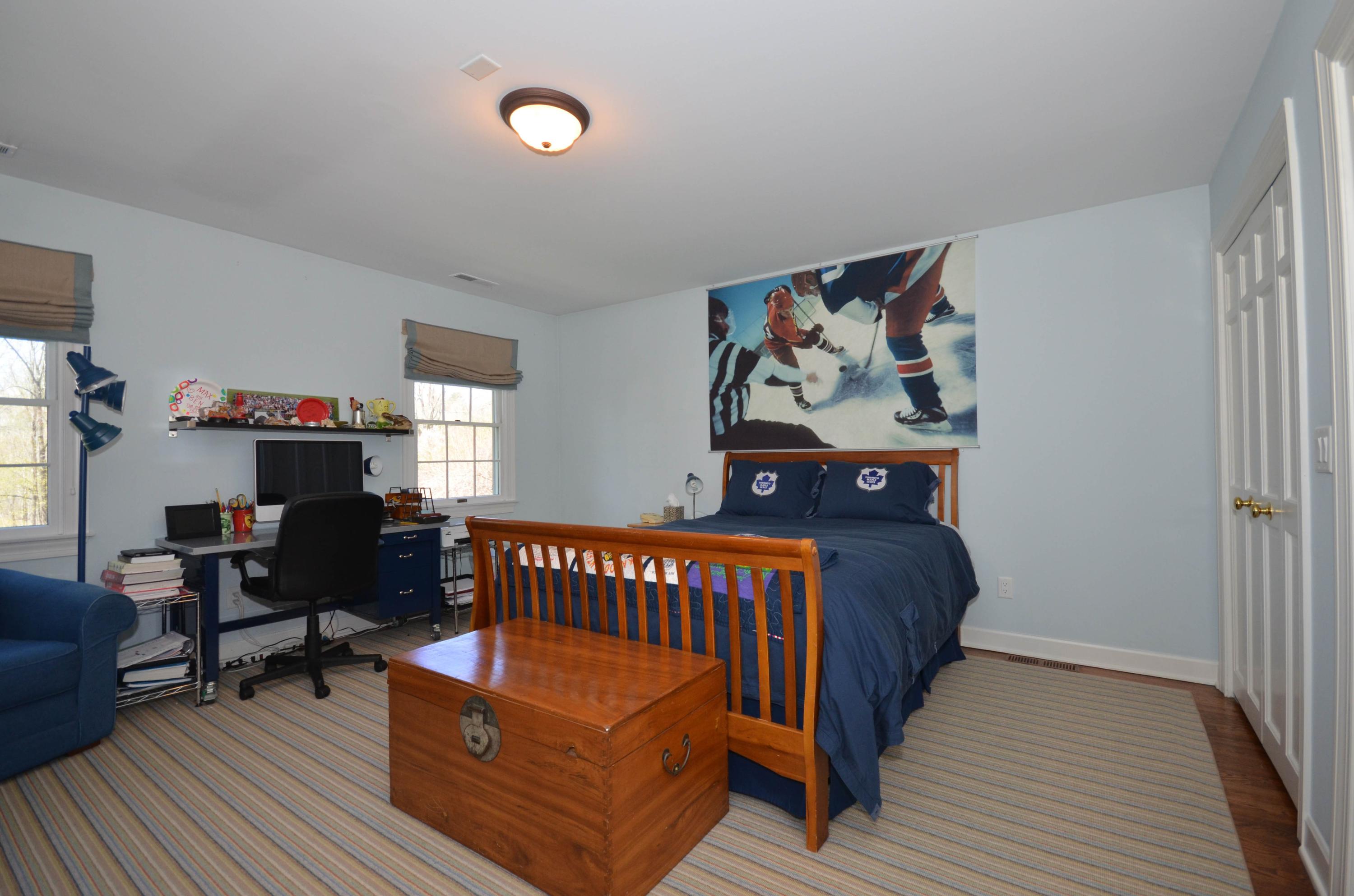 222 Marshall Ridge Road New Canaan, CT 06840 - Photo 35 of 49 a bedroom with furniture and wooden floor