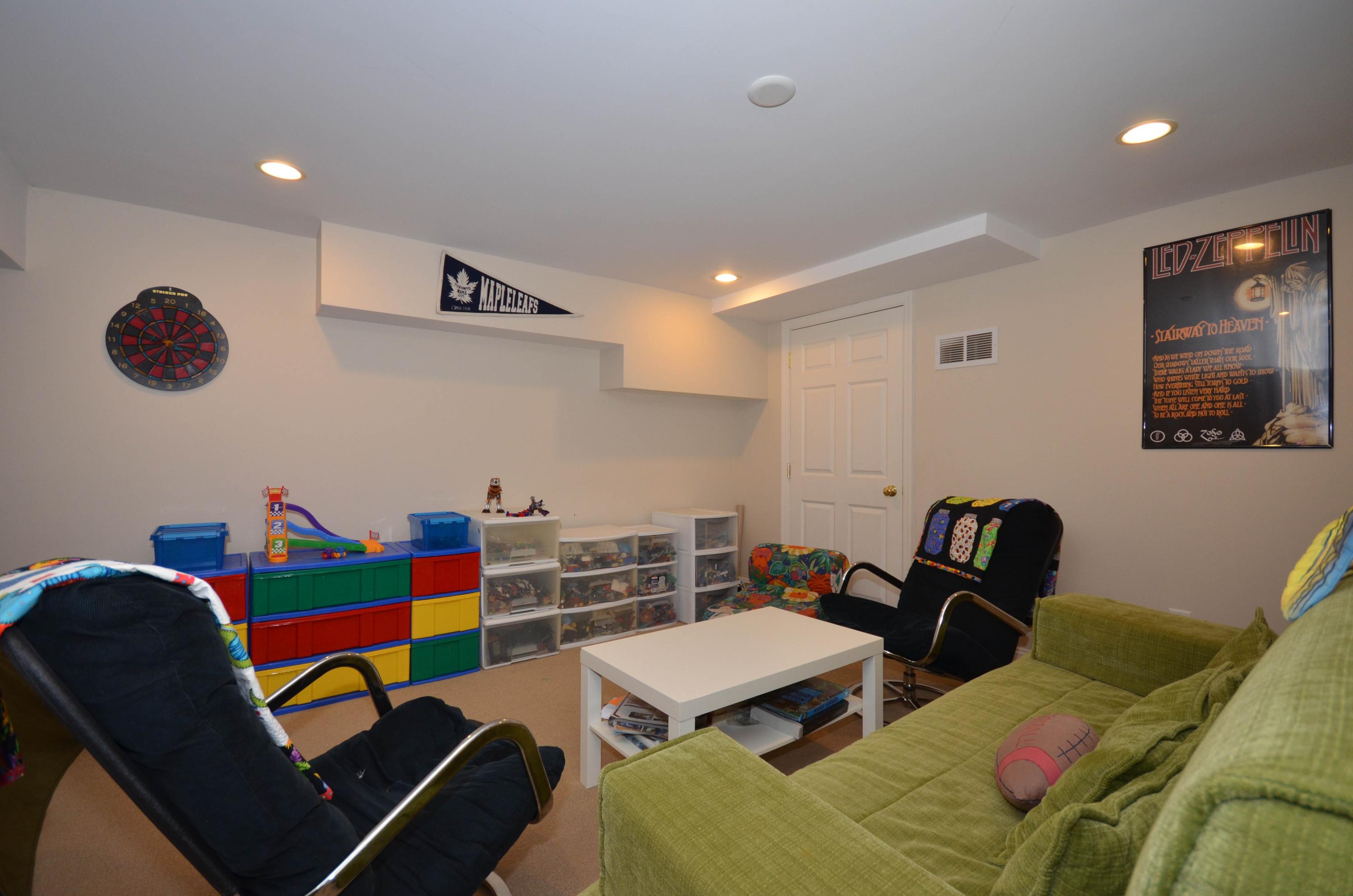 222 Marshall Ridge Road New Canaan, CT 06840 - Photo 38 of 49 a room with furniture and a chair
