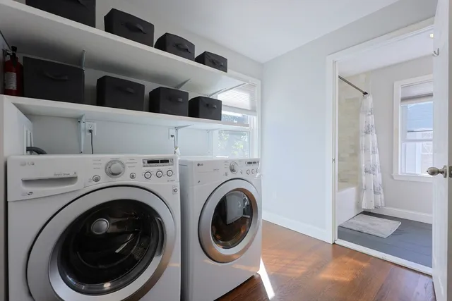 a view of a hallway with washer and dryer