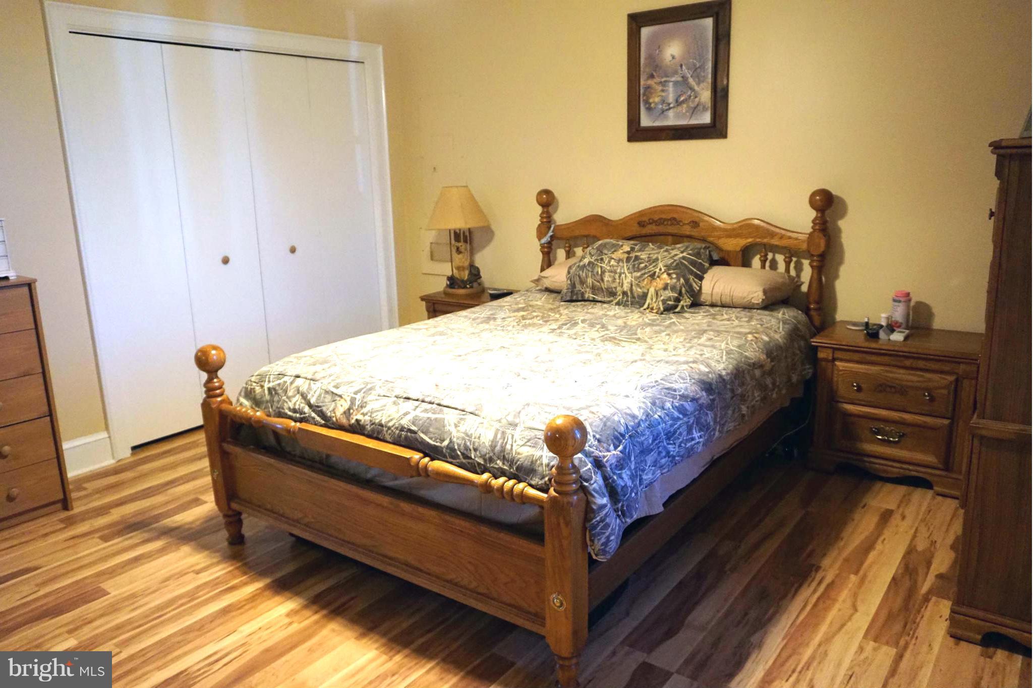 11629 Lynch Road Worton, MD 21678 - Photo 11 of 15 a bedroom with a bed and a flat tv screen on dresser