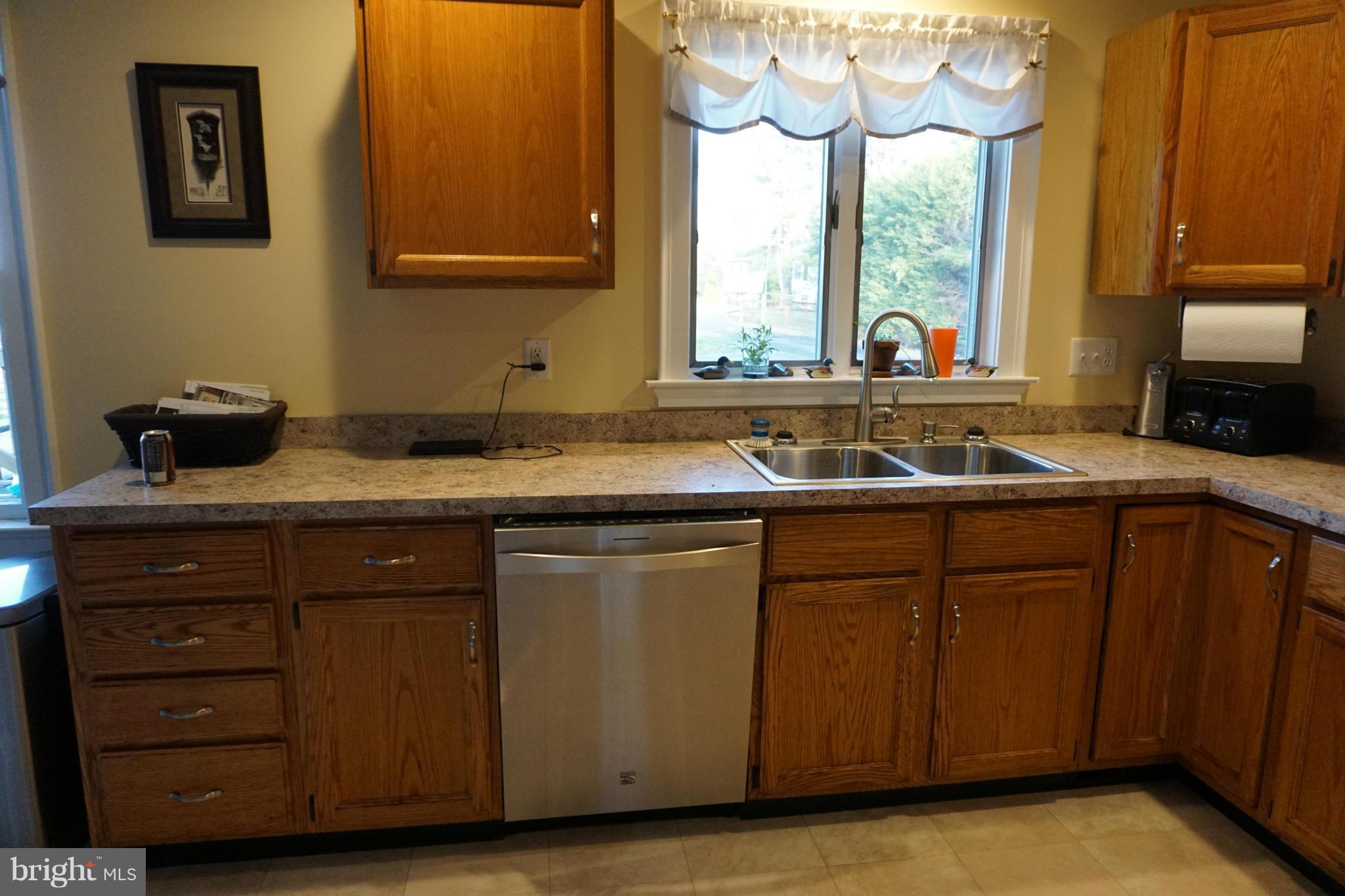 11629 Lynch Road Worton, MD 21678 - Photo 5 of 15 a kitchen with a sink and a window