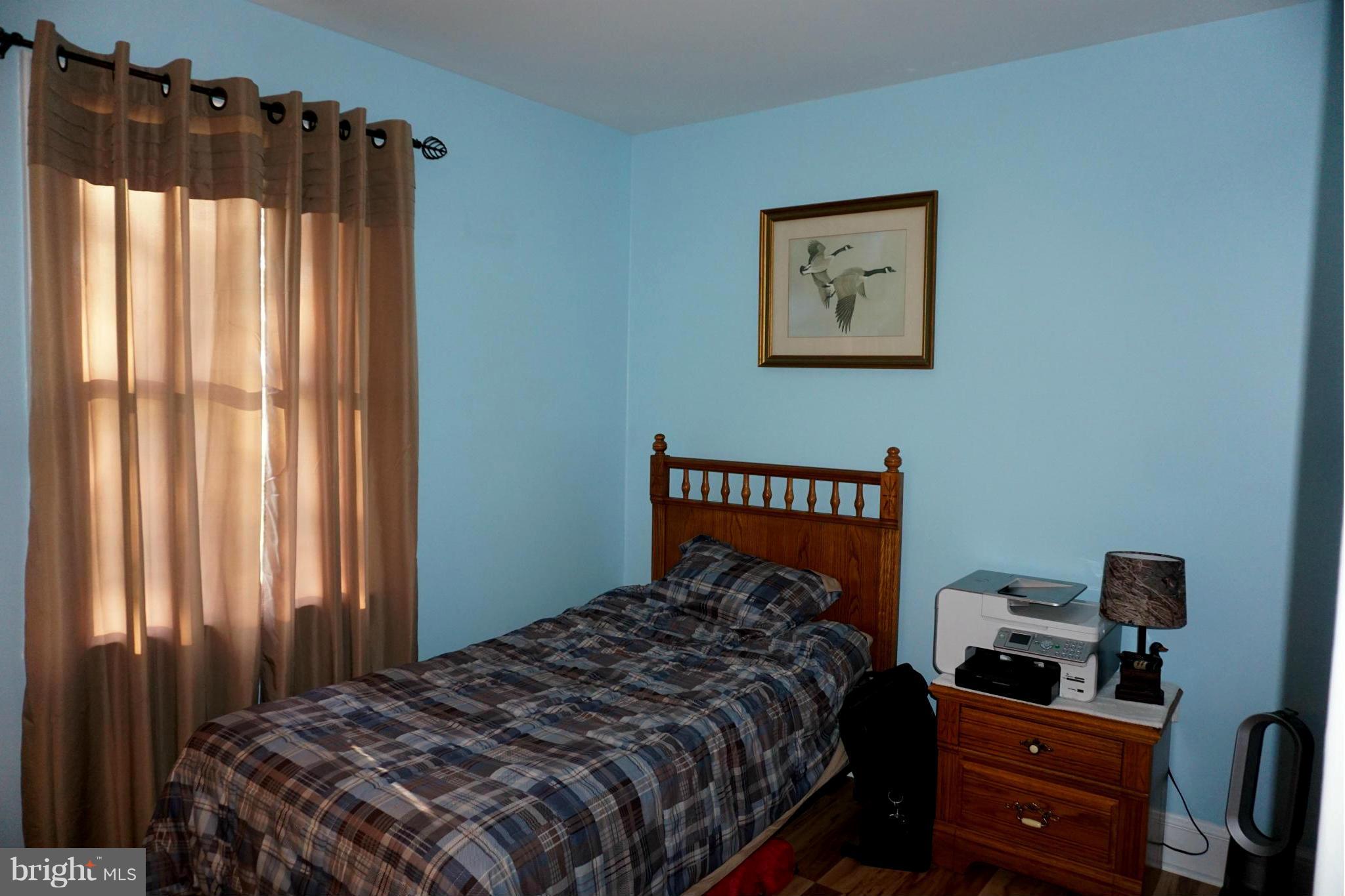 11629 Lynch Road Worton, MD 21678 - Photo 10 of 15 a bedroom with a bed and a window