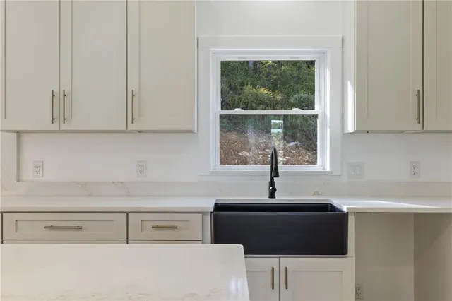 a kitchen with a sink and a window