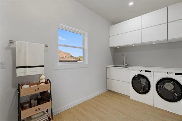 a storage room with washer and dryer