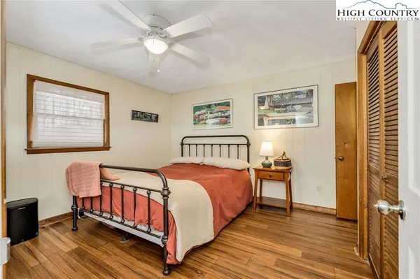 a bed room with a bed and a night stand