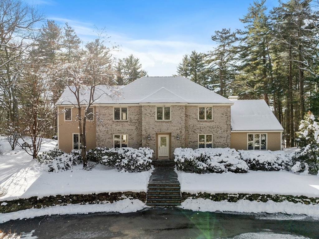 132 Williams Road Concord, MA 01742 - Photo 12 of 38 a front view of a house with a yard and lake view