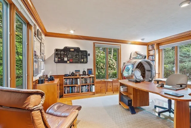 a workspace with furniture and a window