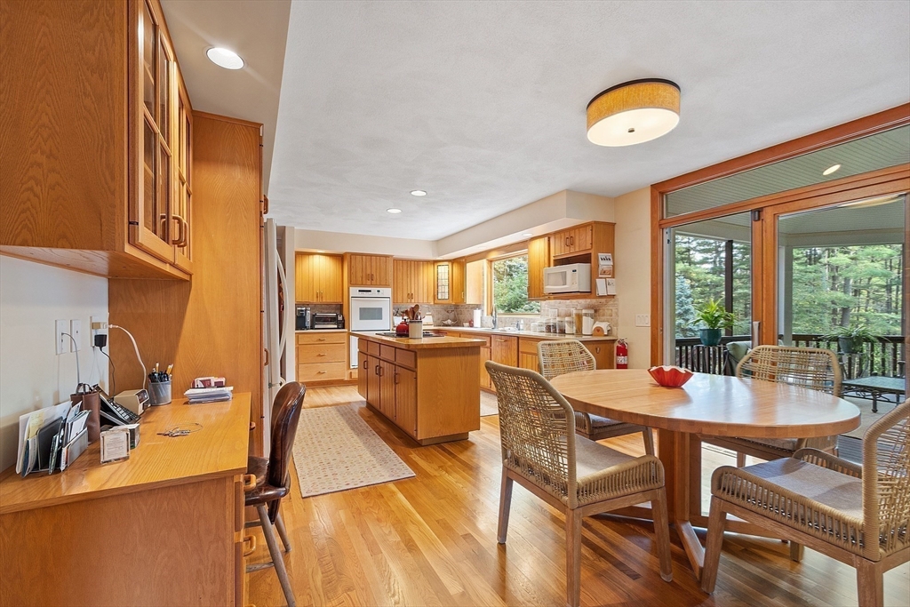 132 Williams Road Concord, MA 01742 - Photo 19 of 38 a dining room with furniture and a floor to ceiling window