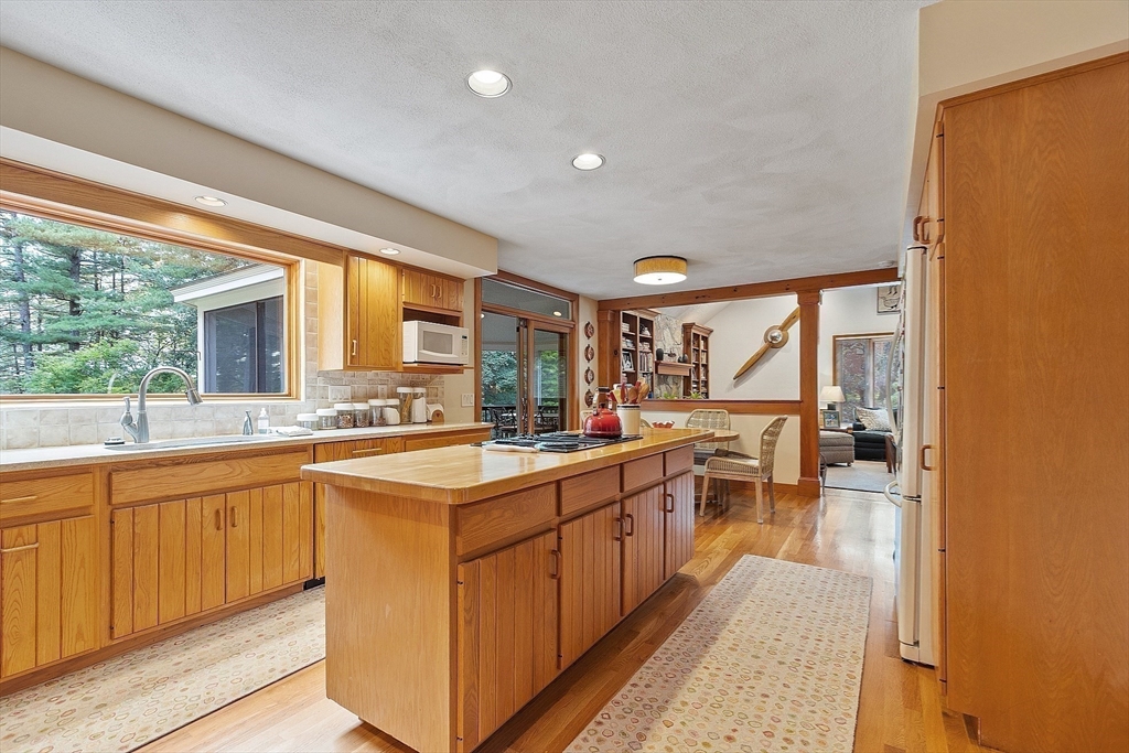 132 Williams Road Concord, MA 01742 - Photo 20 of 38 a large kitchen with a lot of counter space and a wooden floor