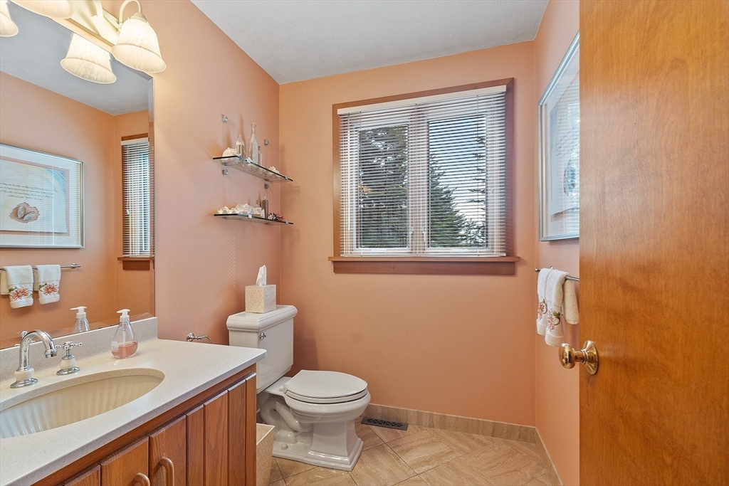 132 Williams Road Concord, MA 01742 - Photo 24 of 38 a bathroom with a toilet a sink and a mirror