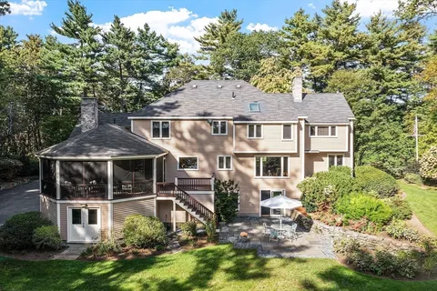 a aerial view of a house with yard and sitting area