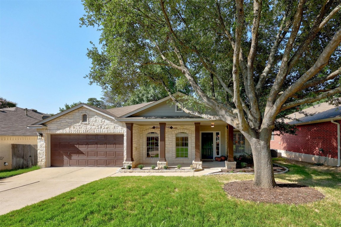 a front view of a house with garden