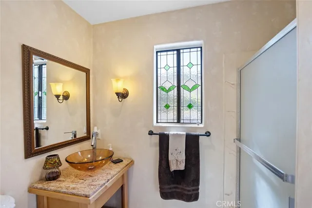 a bathroom with sink and mirror