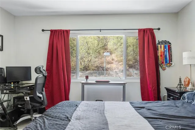 a bathroom with a granite countertop sink vanity and mirror