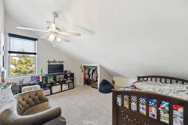 a bed room with a bed and a window