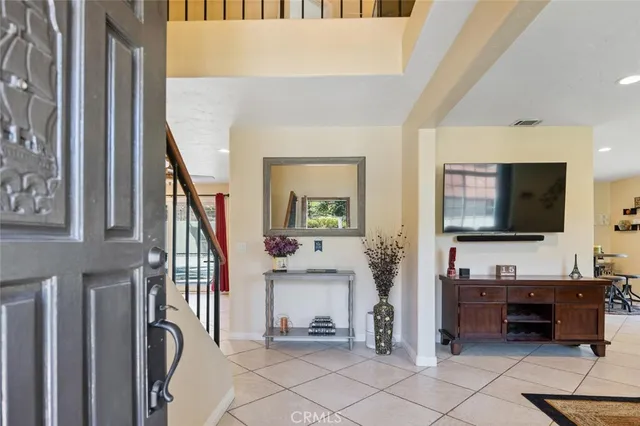 a view of living room kitchen and entryway