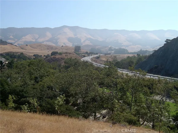 a view of a town with mountains in the background