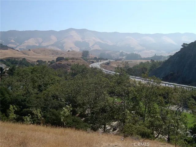 a view of a town with mountains in the background